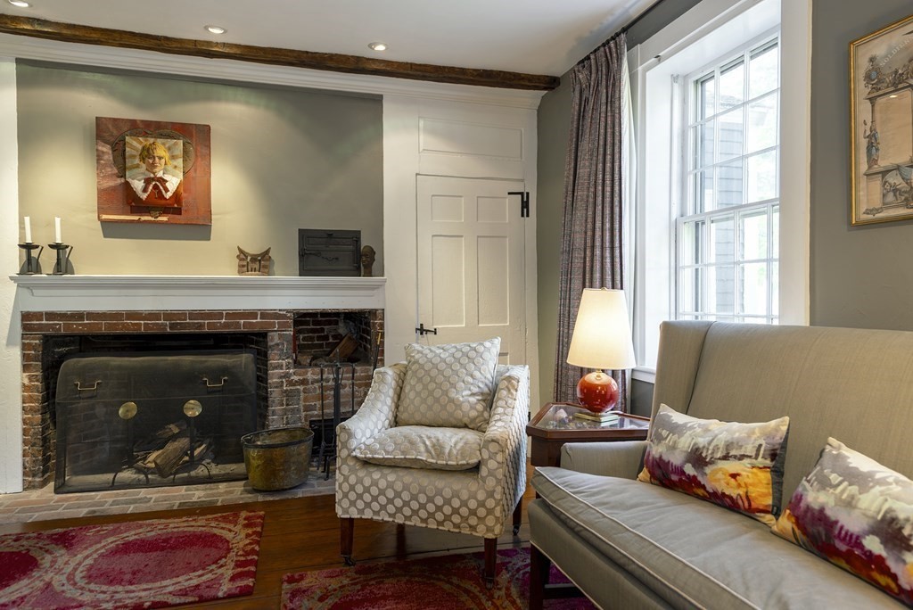 88 County Road Ipswich, MA 01938 - Photo 6 of 40 a living room with furniture and a fireplace