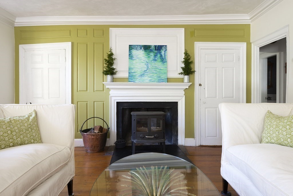88 County Road Ipswich, MA 01938 - Photo 8 of 40 a living room with furniture and a fireplace
