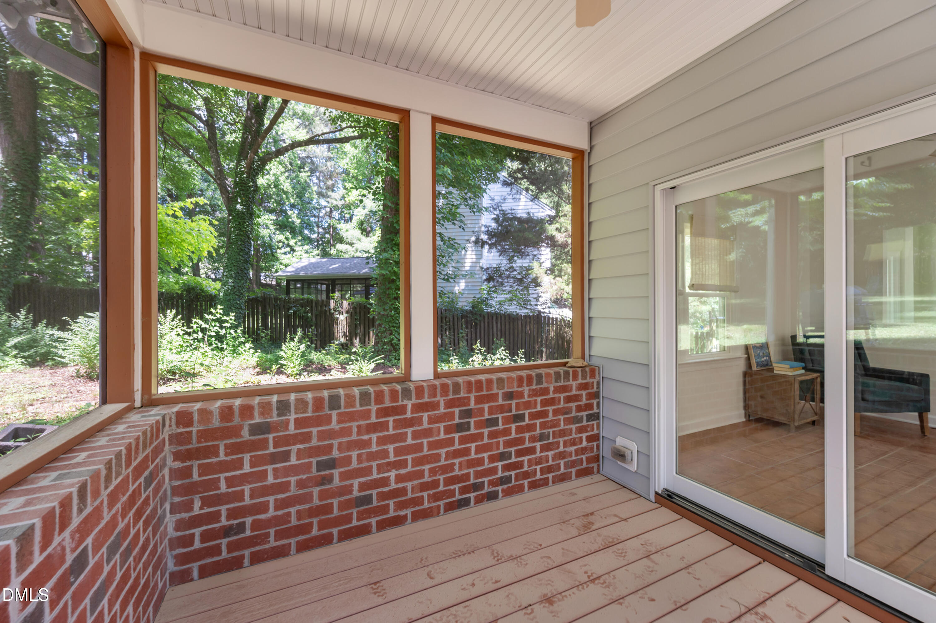 7500 Drayton Court Raleigh, NC 27615 - Photo 10 of 27 a view of an empty room with wooden floor and balcony