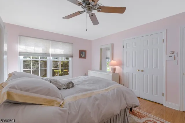 a spacious bedroom with a bed and a window