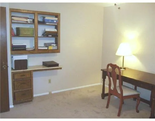 a workspace with furniture and lamp