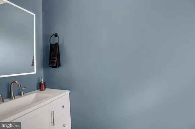 a bathroom with a shower curtain and window