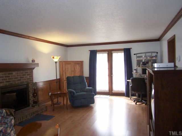 5321 Ridgeloch Place Raleigh, NC 27612 - Photo 3 of 10 a living room with furniture and a fireplace