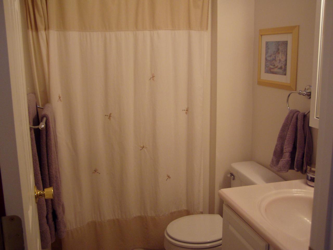 1122 Mountain View Road Vinton, VA 24179 - Photo 18 of 20 a white toilet sitting next to a bathroom sink