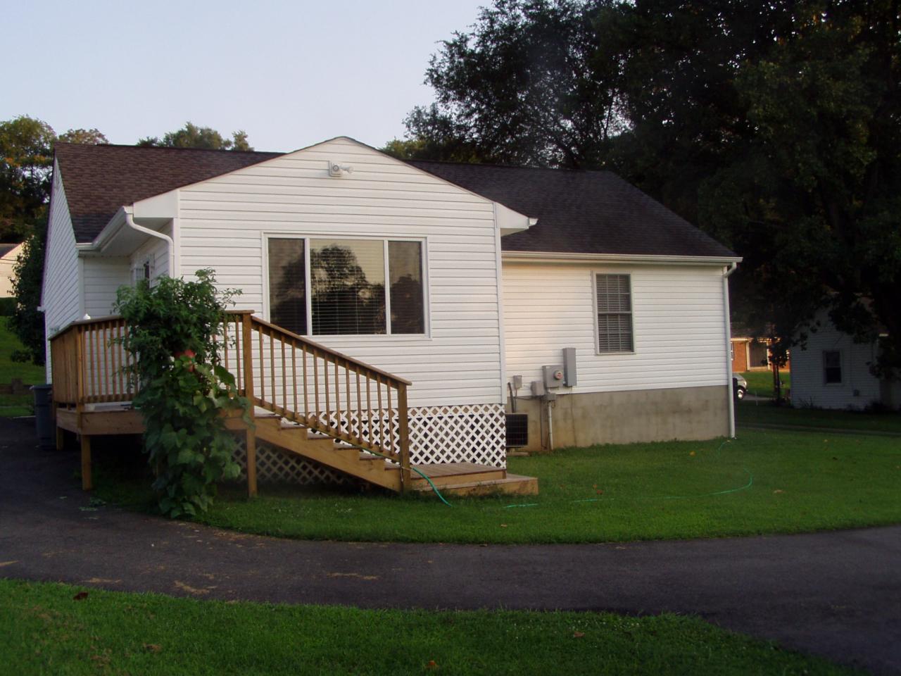 1122 Mountain View Road Vinton, VA 24179 - Photo 4 of 20 a front view of a house with a garden
