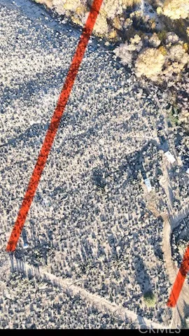 a brick building with a trees in the background