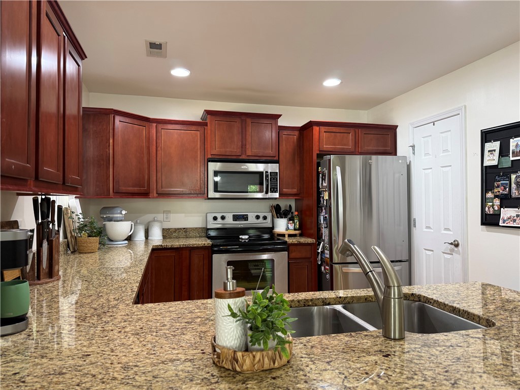 123 Abigail Lane Anderson, SC 29621 - Photo 7 of 22 This functional kitchen features ample cabinet space, modern appliances, and a practical layout perfect for everyday living.