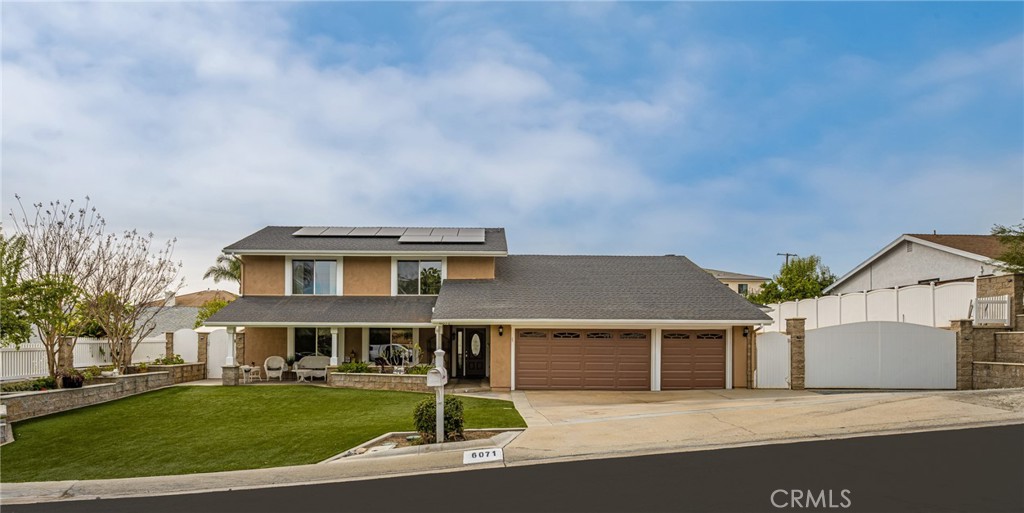 Expansive lot with 3 car garage and RV parking behind the gate