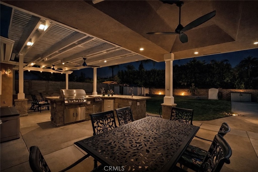 6071 Sun View Road Yorba Linda, CA 92886 - Photo 19 of 49 a view of a patio with dining table and chairs