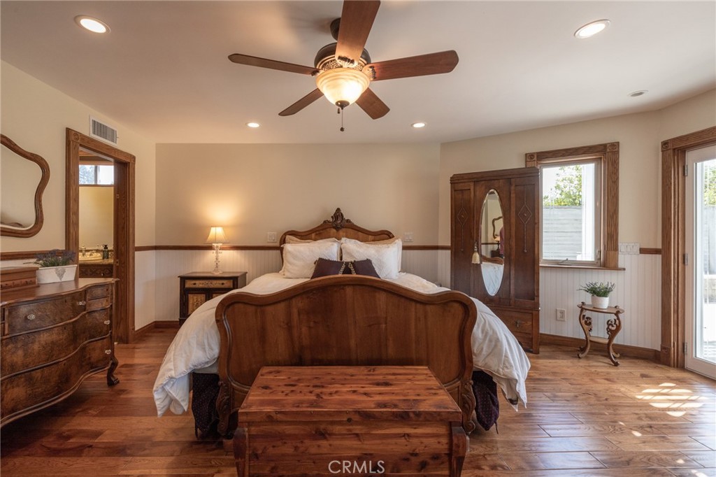 6071 Sun View Road Yorba Linda, CA 92886 - Photo 23 of 49 a bedroom with a bed and wooden floor
