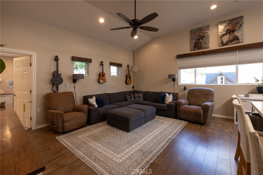 6071 Sun View Road Yorba Linda, CA 92886 - Photo 36 of 49 a living room with furniture a large window and wooden floor