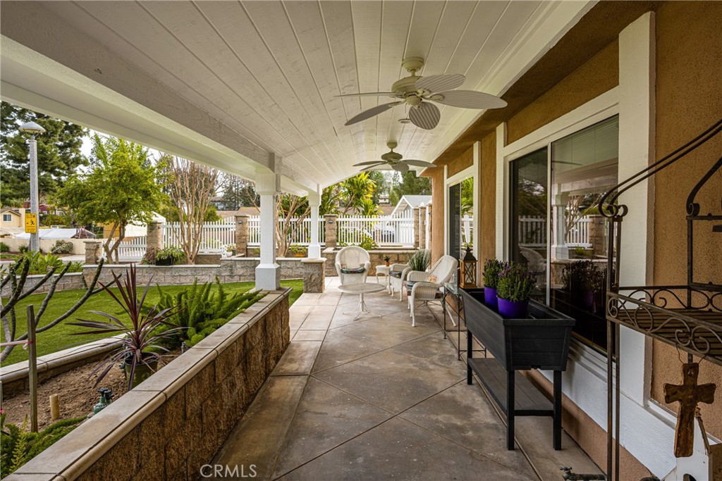6071 Sun View Road Yorba Linda, CA 92886 - Photo 10 of 65 Cement patio across the front has roofing for year around use and ceiling fans for those warm nights
