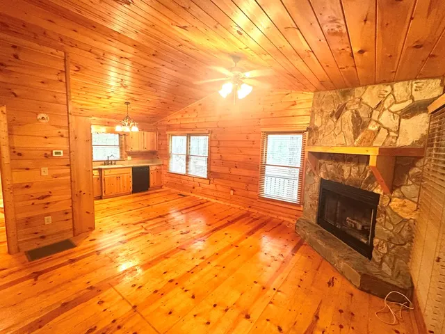 a view of an empty room with a fireplace