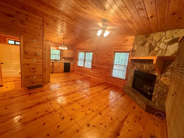 a view of an empty room with a fireplace