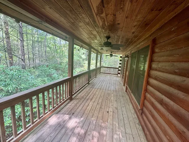 a view of balcony with wooden floor