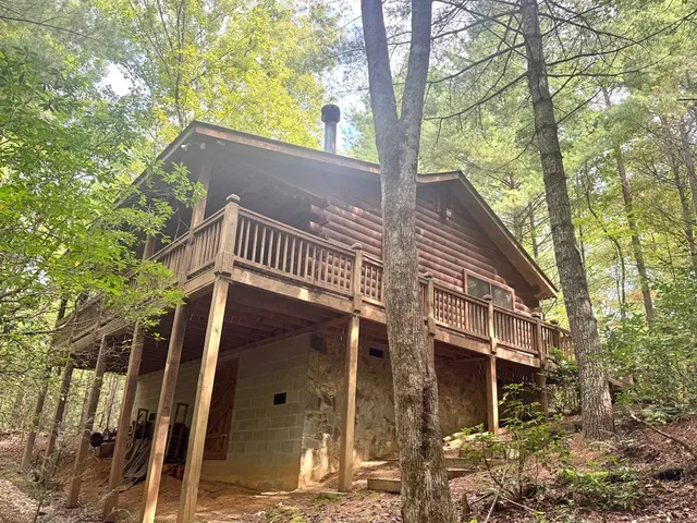 a view of a house with a tree