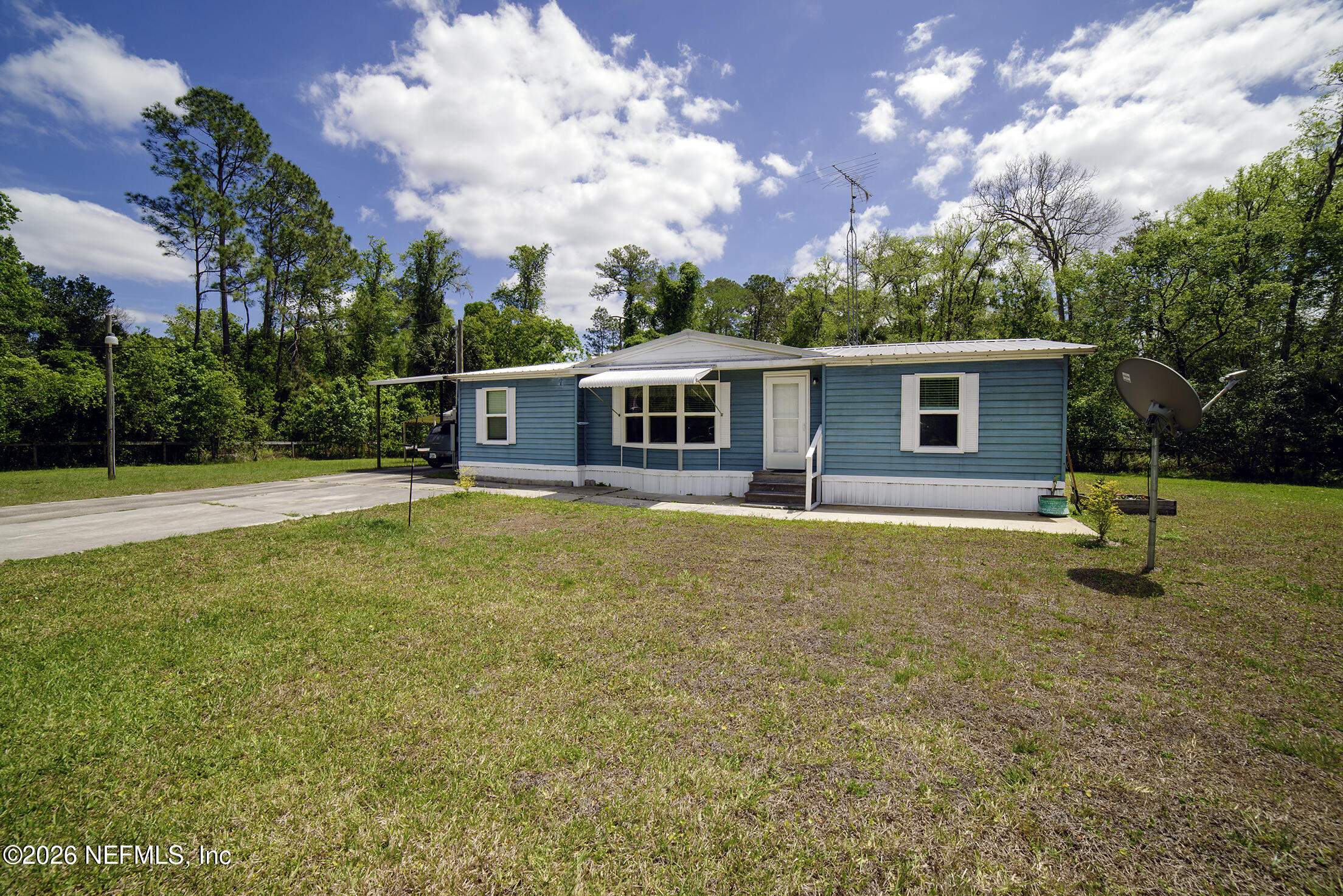 206 Dolphin Drive Georgetown, FL 32139 - Photo 1 of 27 a view of a house with a backyard