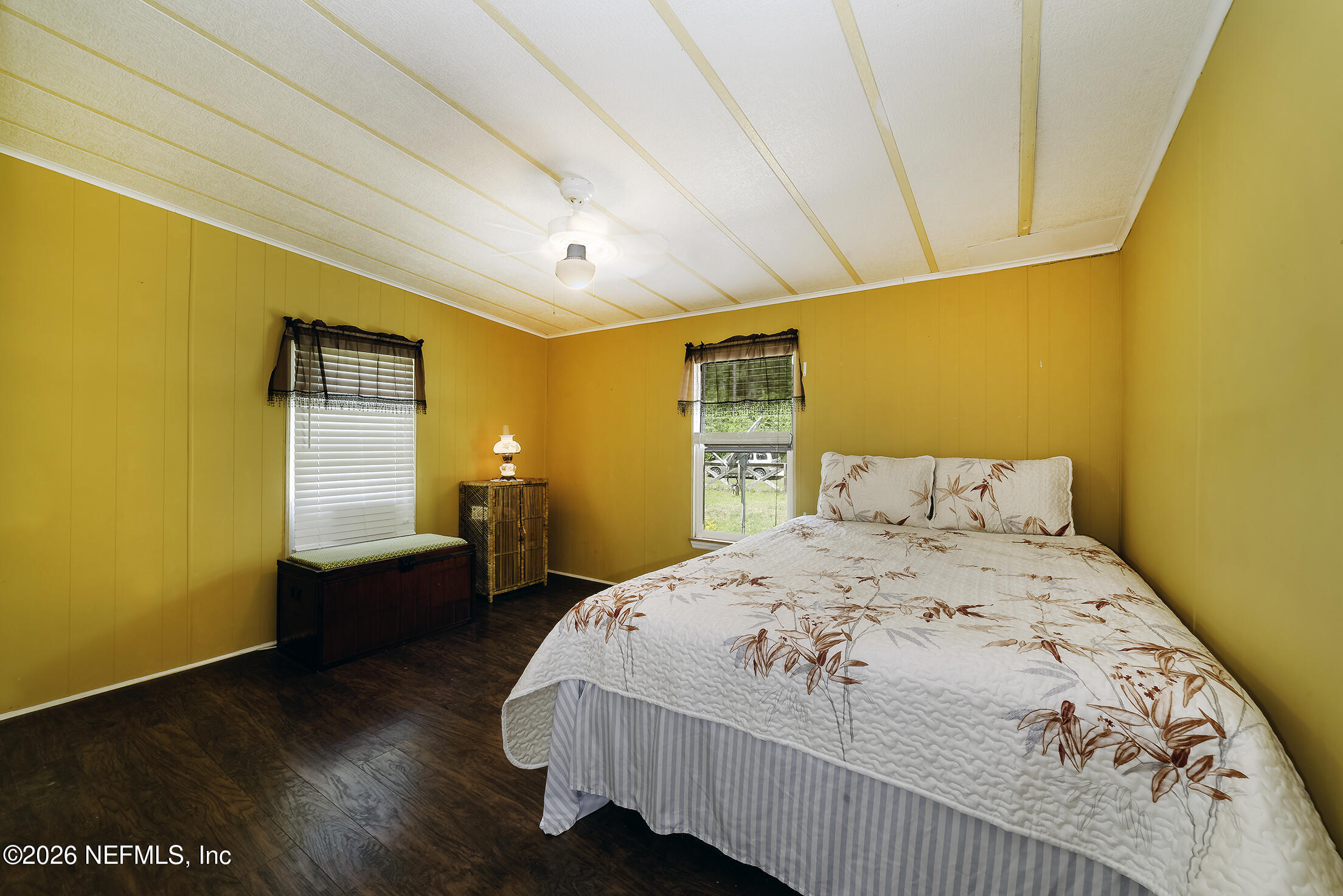 206 Dolphin Drive Georgetown, FL 32139 - Photo 11 of 27 a bedroom with a bed and wooden floor