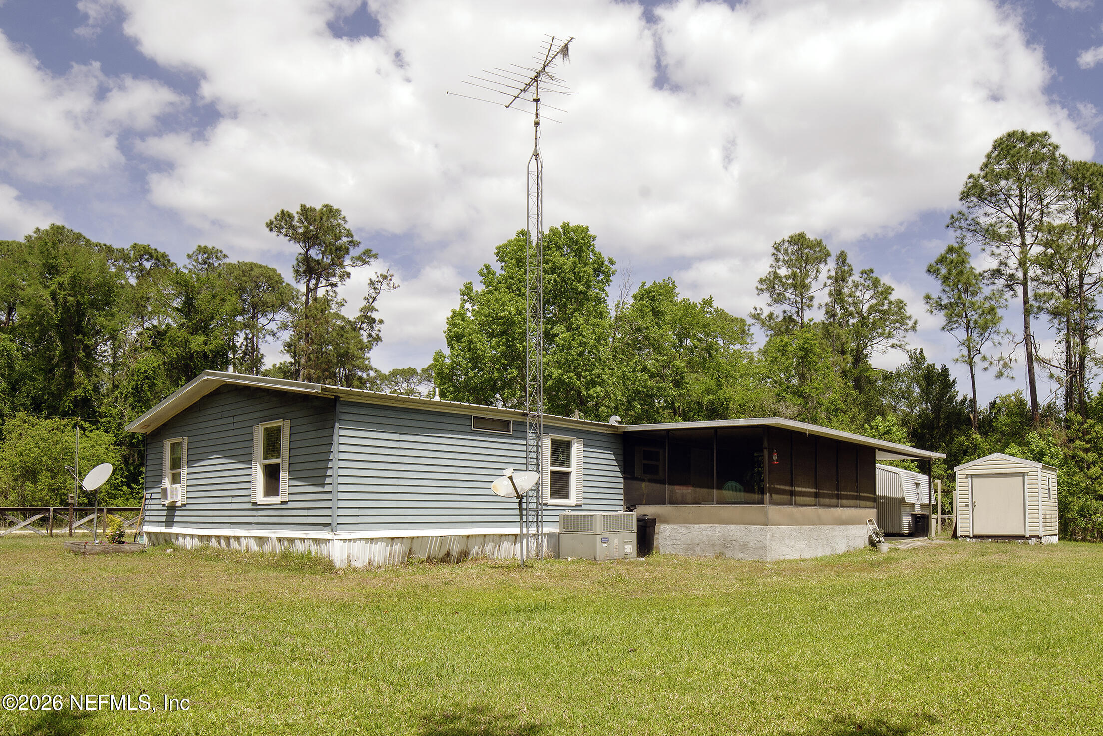 206 Dolphin Drive Georgetown, FL 32139 - Photo 16 of 27 a house with swimming pool in front of it
