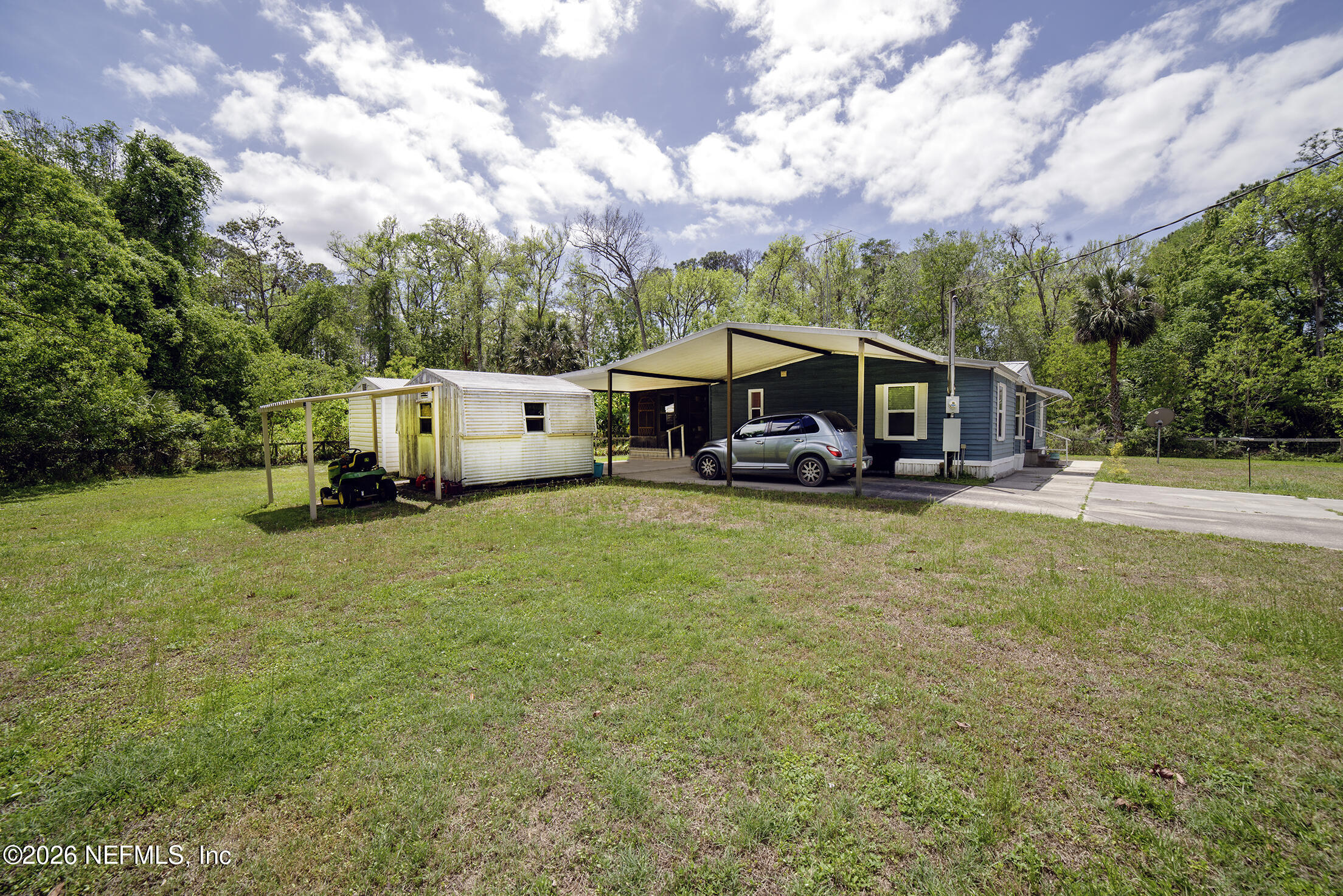 206 Dolphin Drive Georgetown, FL 32139 - Photo 17 of 27 an aerial view of a house with swimming pool and garden