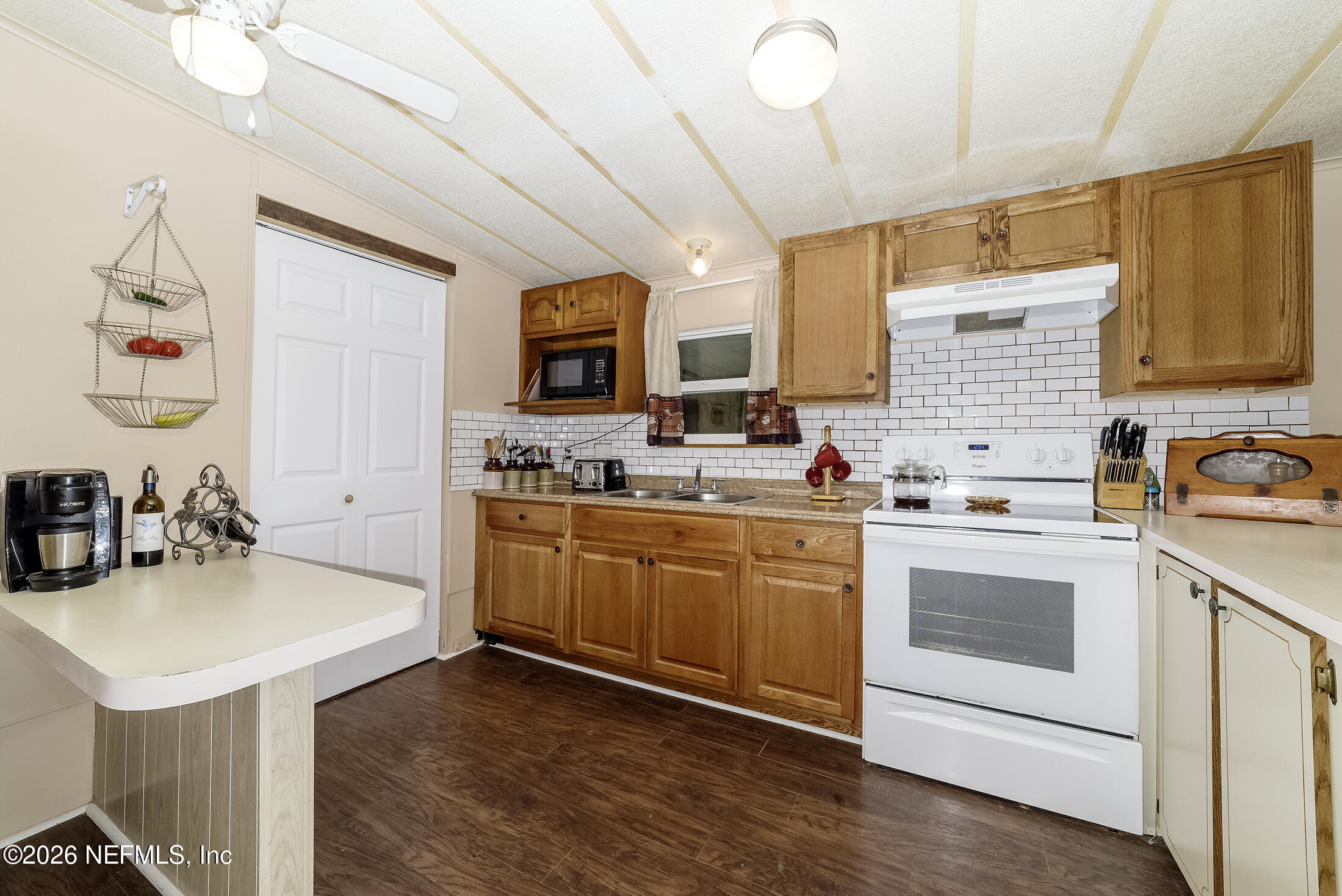 206 Dolphin Drive Georgetown, FL 32139 - Photo 20 of 27 a kitchen with a sink cabinets and wooden floor
