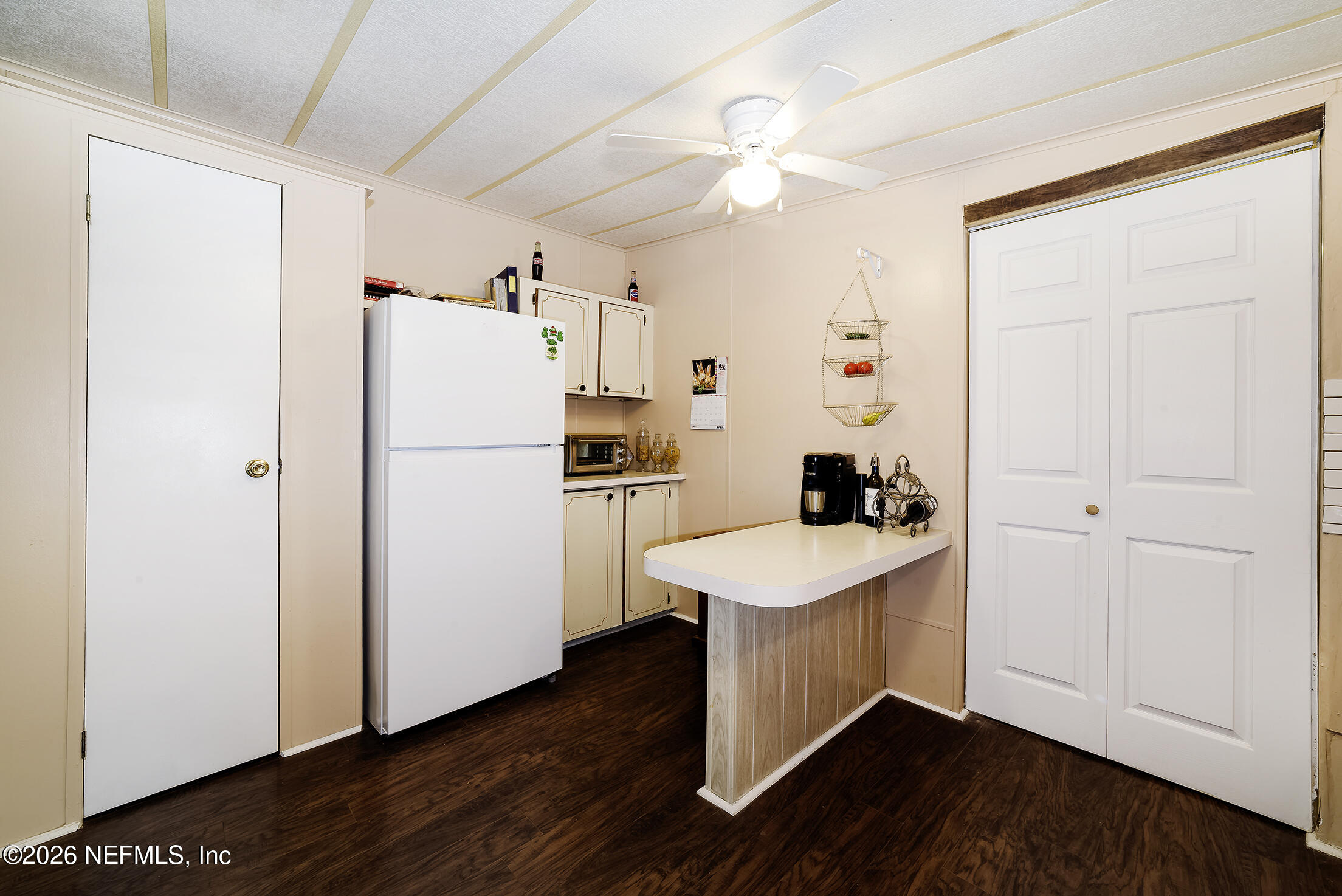 206 Dolphin Drive Georgetown, FL 32139 - Photo 21 of 27 a kitchen with a refrigerator a sink and cabinets