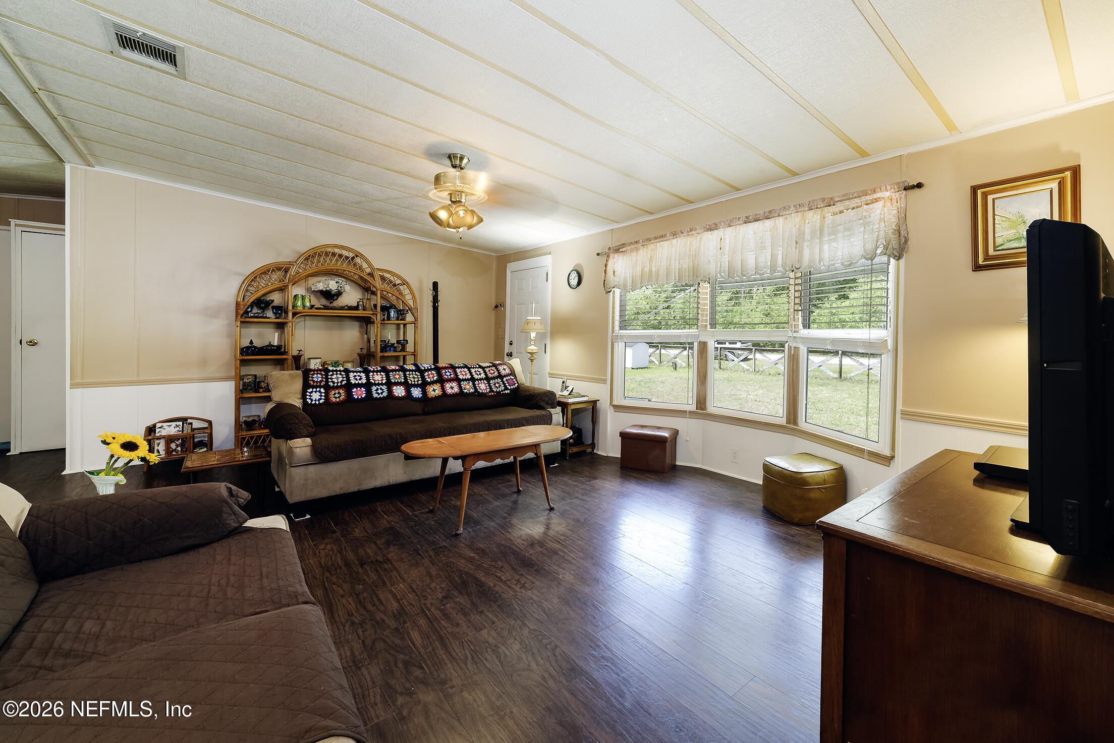 206 Dolphin Drive Georgetown, FL 32139 - Photo 23 of 27 a bedroom with furniture and a large window