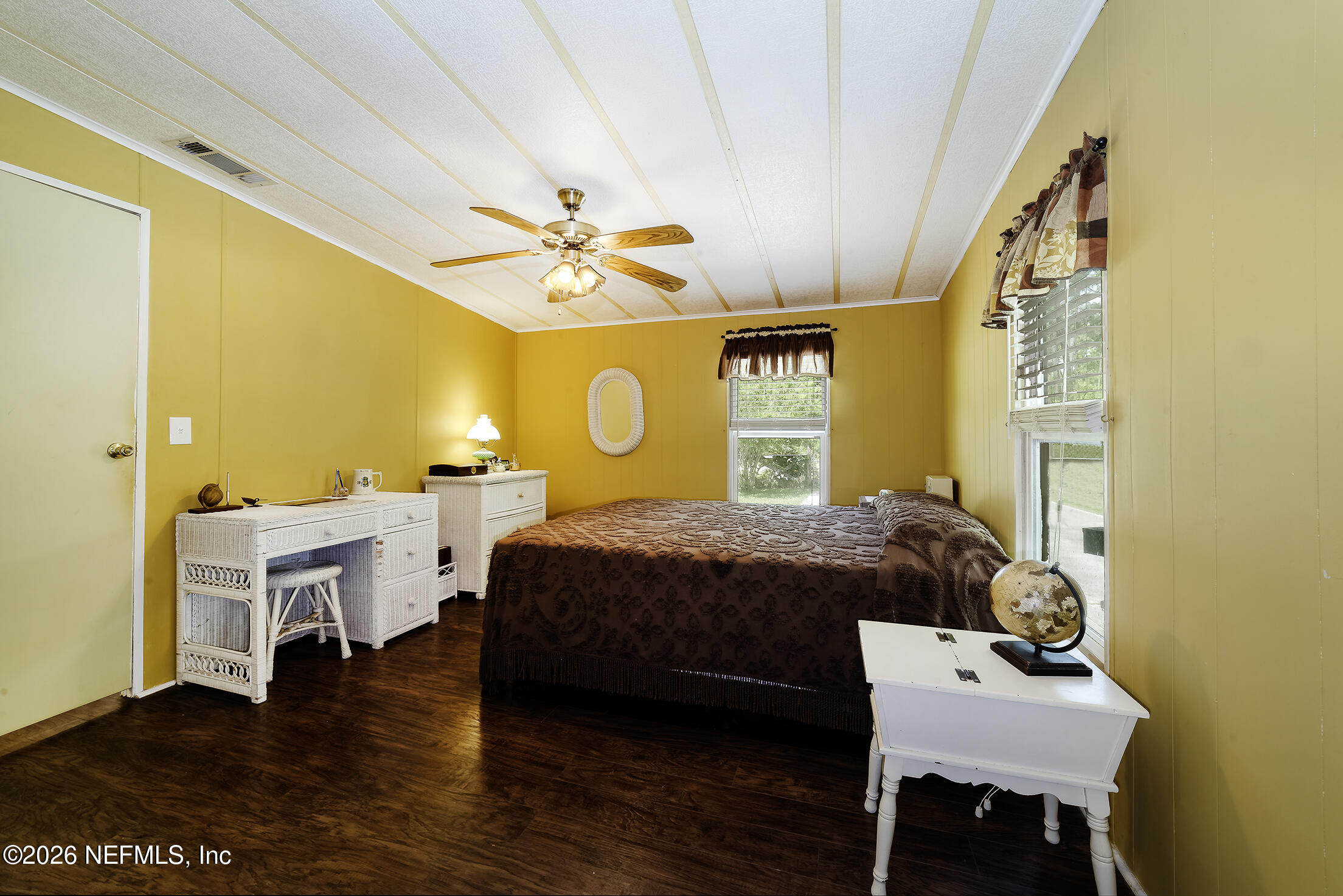206 Dolphin Drive Georgetown, FL 32139 - Photo 27 of 27 a bedroom with a bed and a table in it