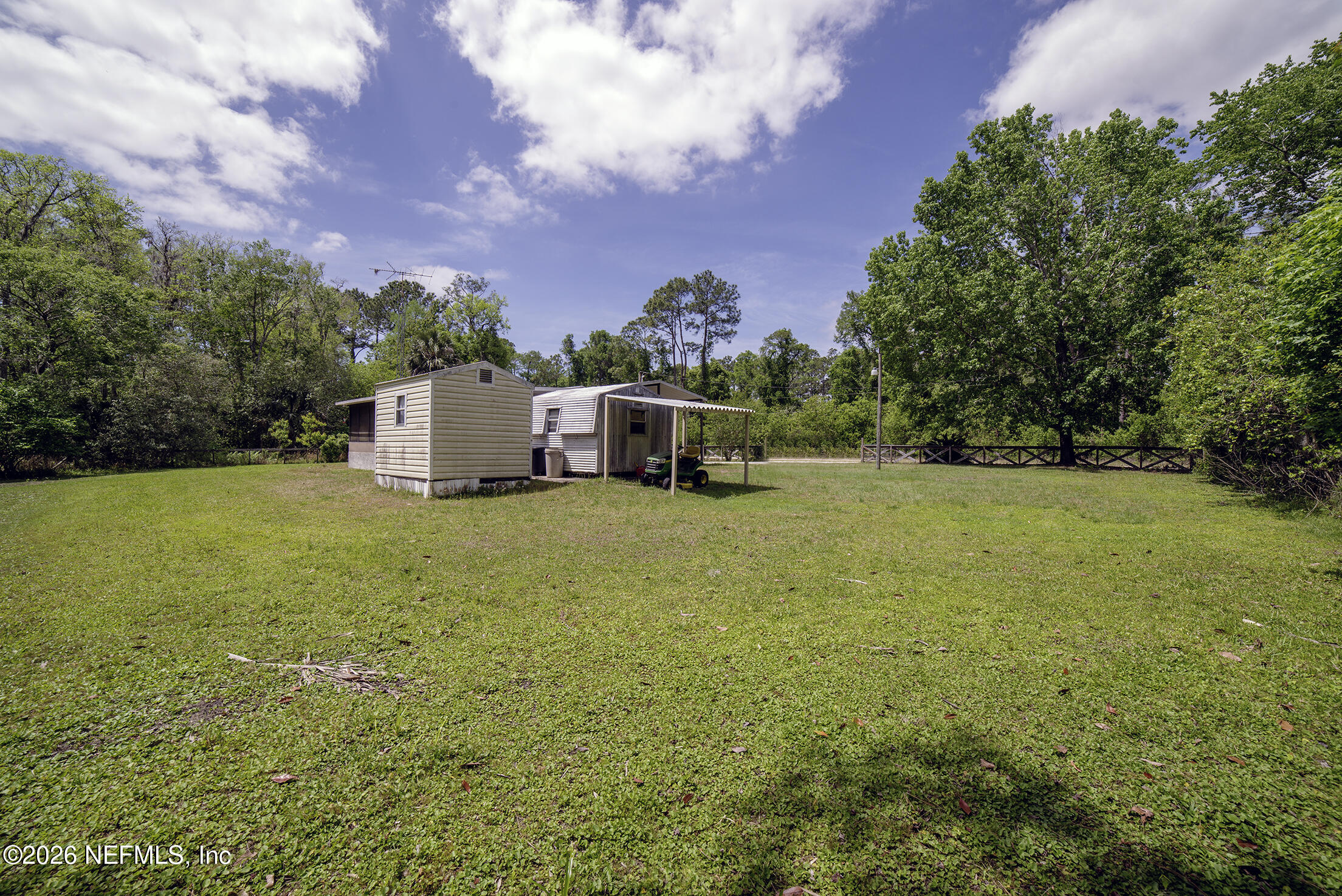 206 Dolphin Drive Georgetown, FL 32139 - Photo 6 of 27 a backyard of a house with lots of green space