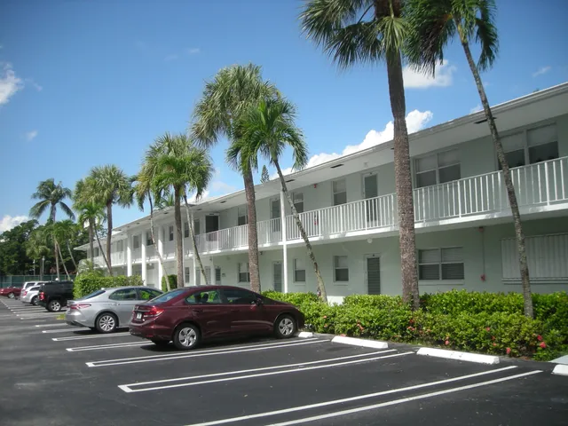 a view of a car parked in front of a building