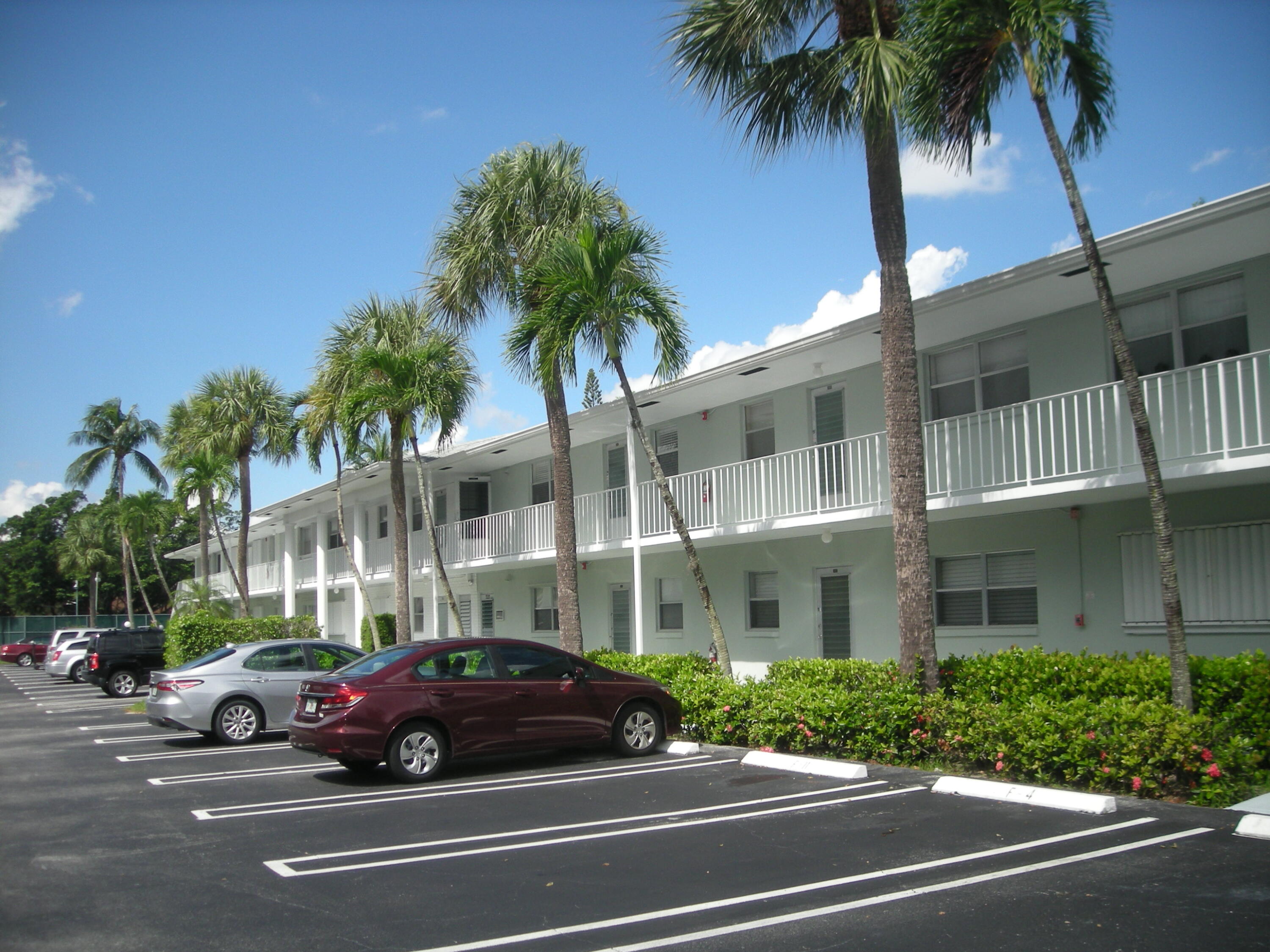 2600 Southwest 22nd Avenue, Unit 903 Delray Beach, FL 33445 - Photo 1 of 27 a view of a car parked in front of a building