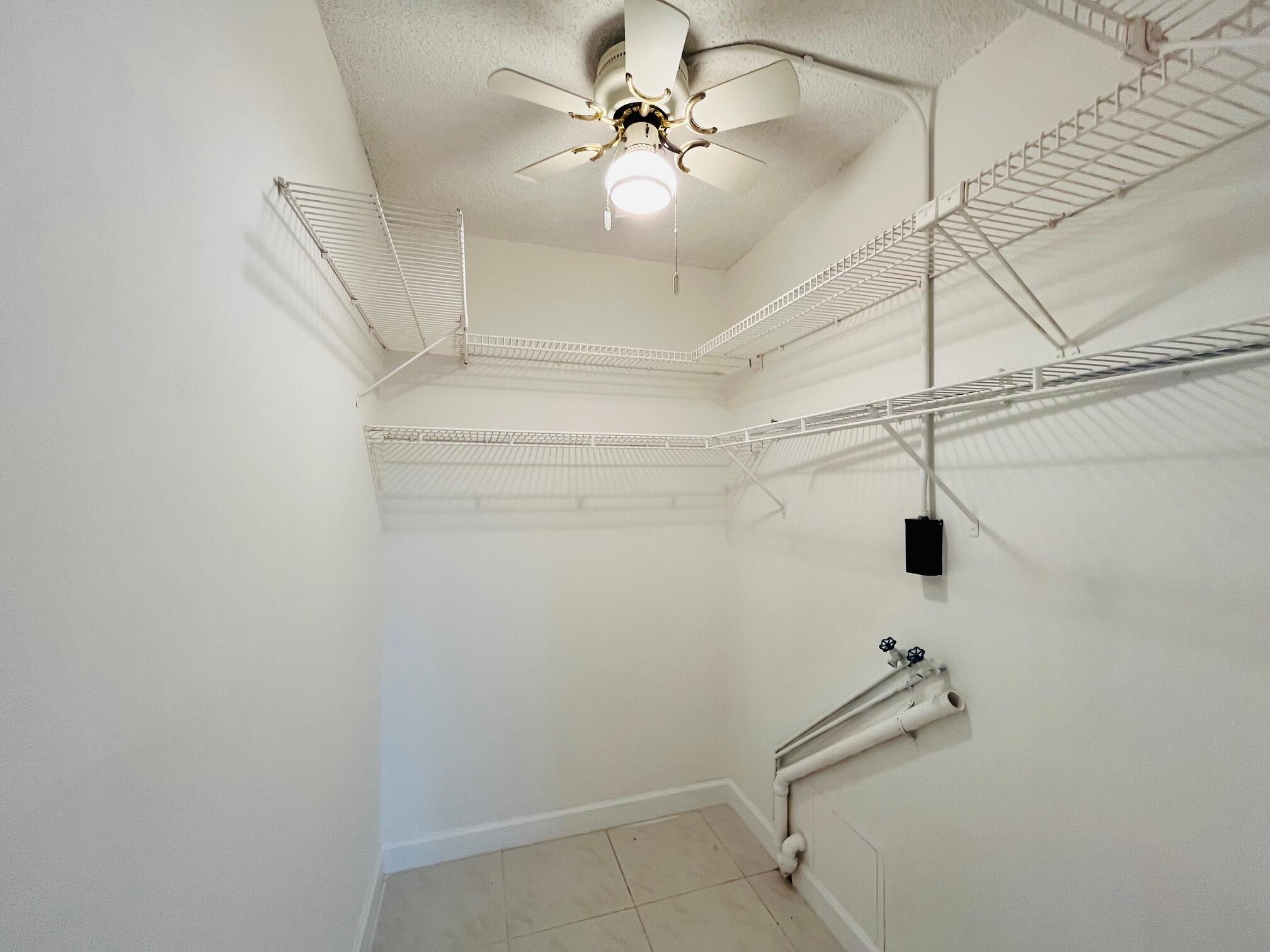 2600 Southwest 22nd Avenue, Unit 903 Delray Beach, FL 33445 - Photo 15 of 27 a very nice looking room with a fan