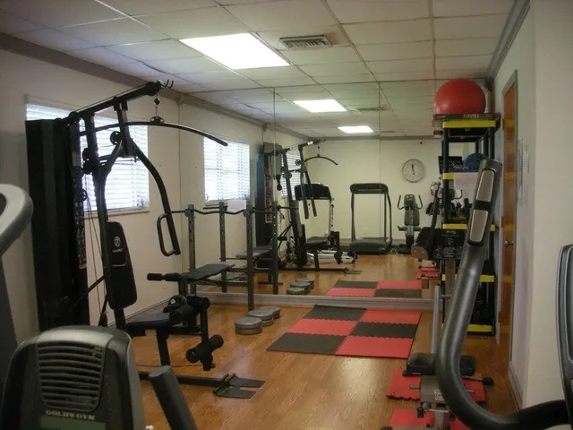a room with lots of gym equipment