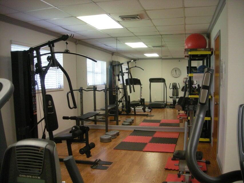 2600 Southwest 22nd Avenue, Unit 903 Delray Beach, FL 33445 - Photo 24 of 27 a room with lots of gym equipment