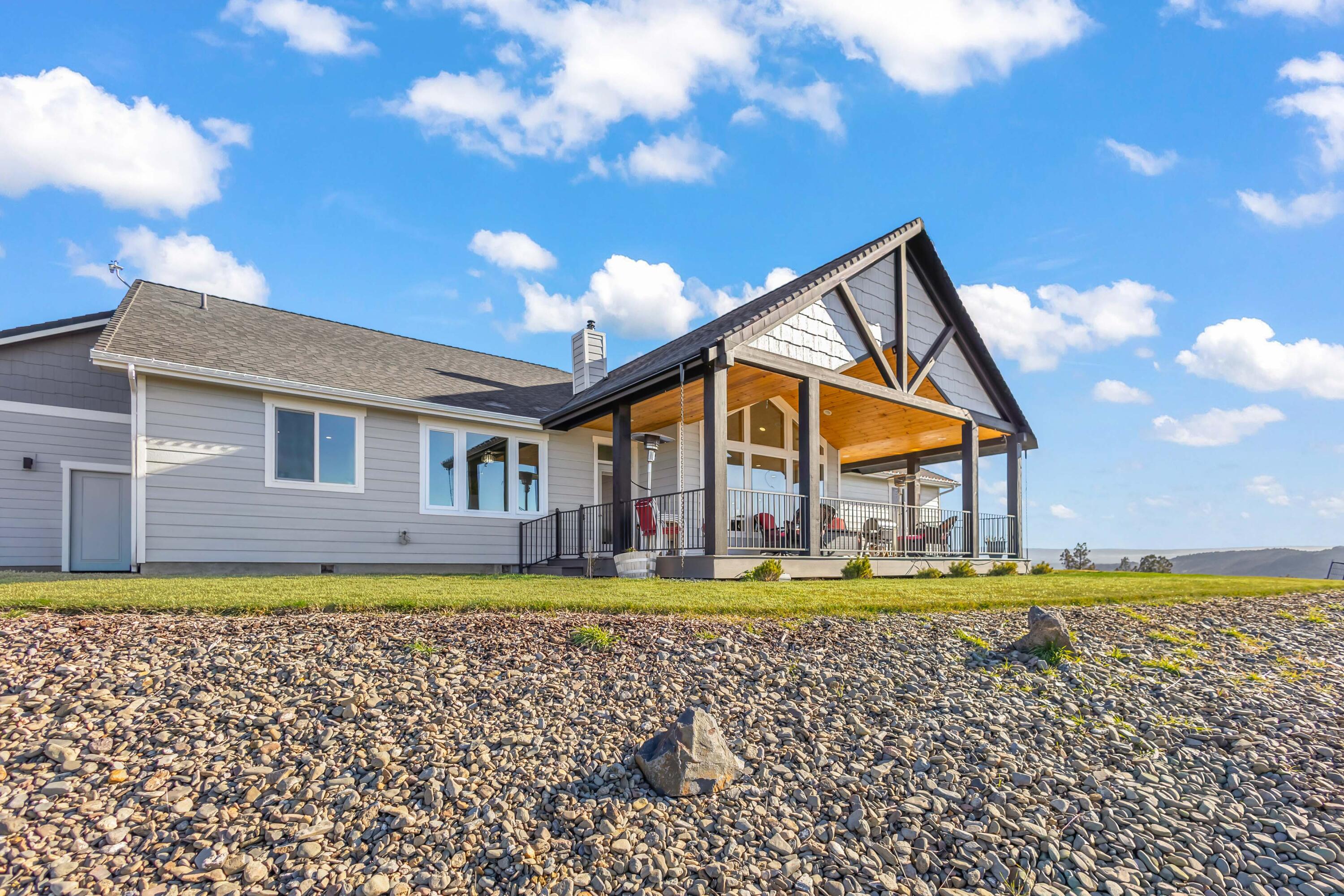 5582 North Mckay Road Prineville, OR 97754 - Photo 33 of 54 a front view of a house with a yard and swimming pool