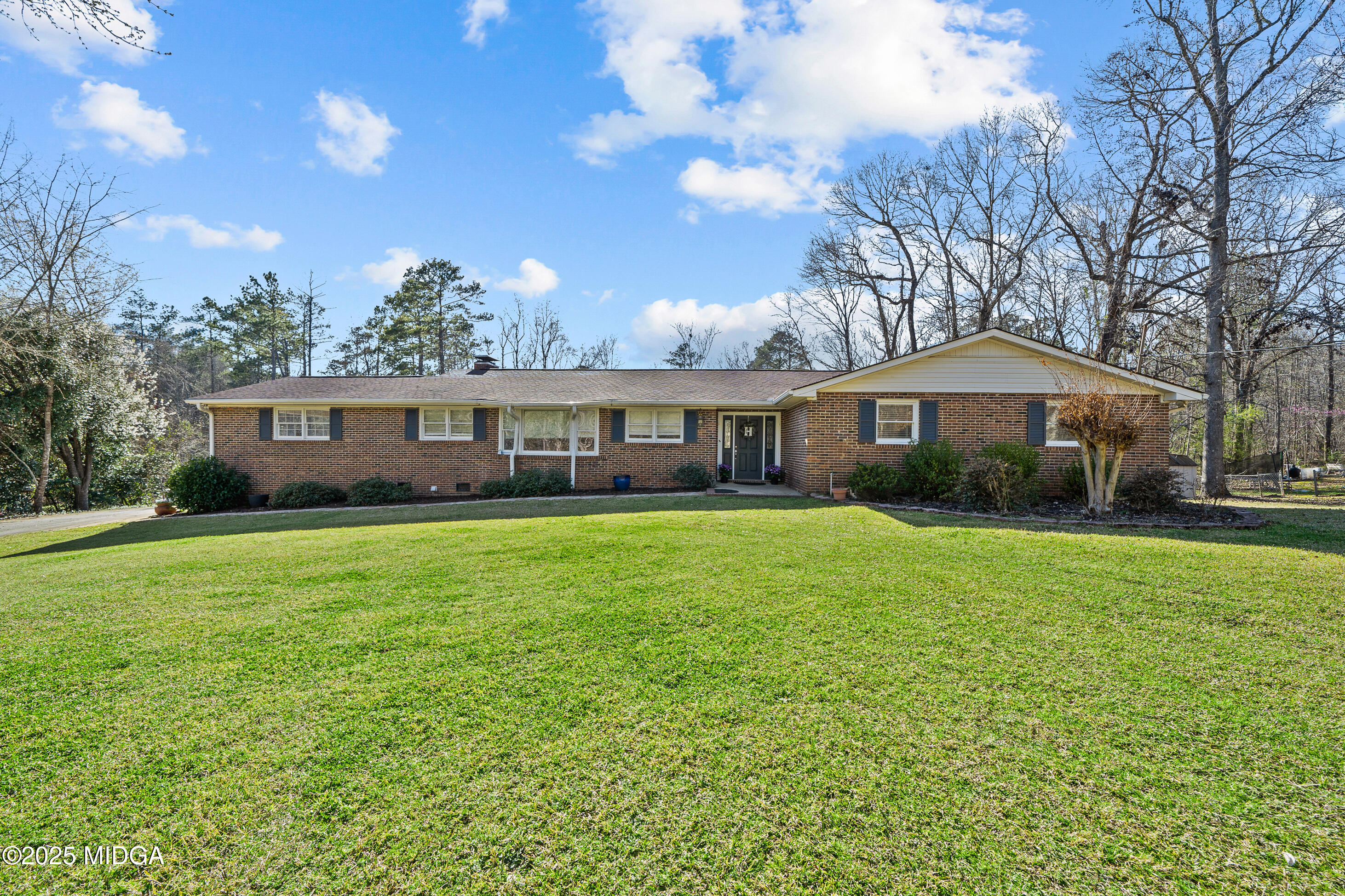 184 Camelot Road Gray, GA 31032 - Photo 1 of 38 a front view of a house with a garden