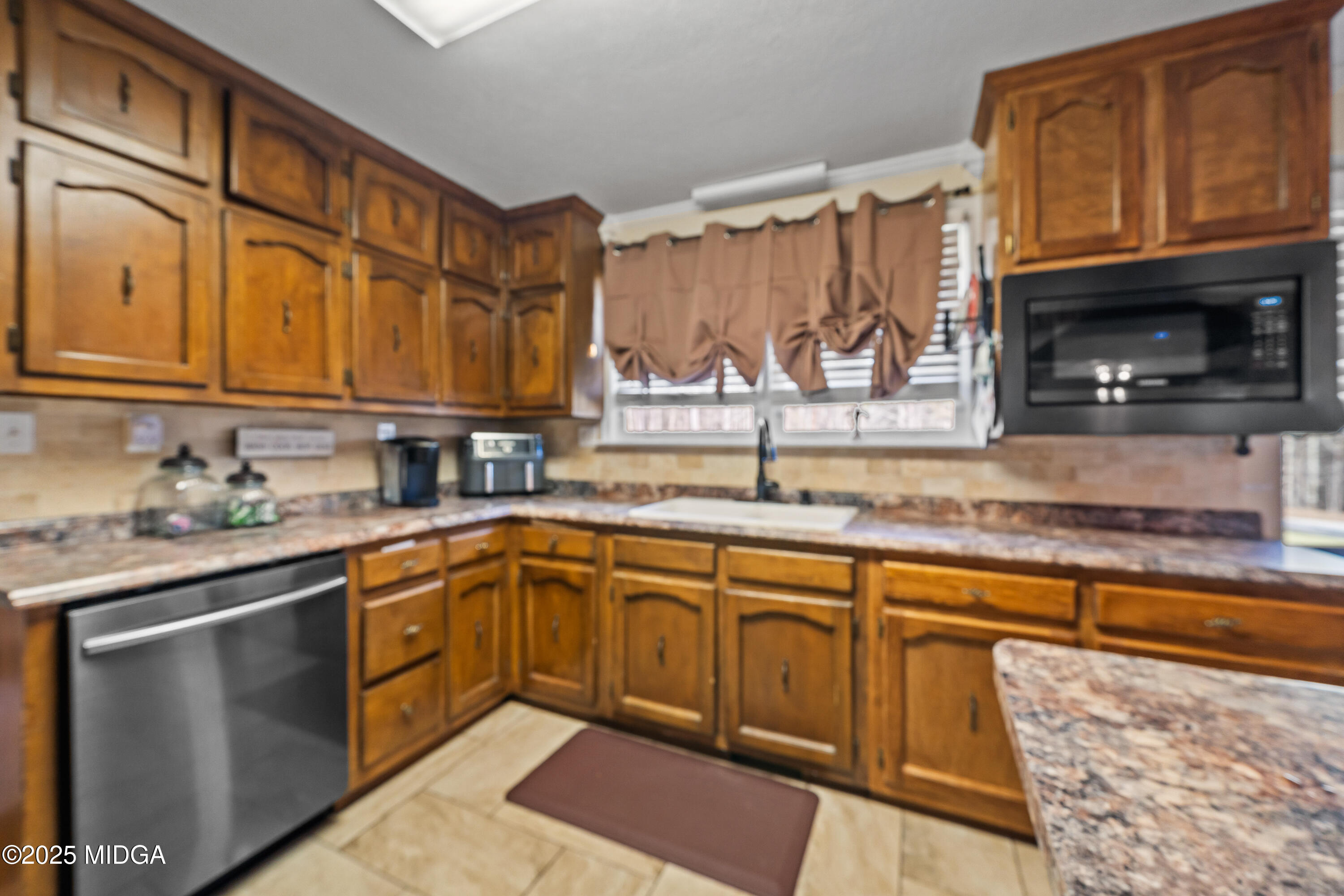 184 Camelot Road Gray, GA 31032 - Photo 12 of 38 a kitchen with stainless steel appliances granite countertop a sink stove and cabinets
