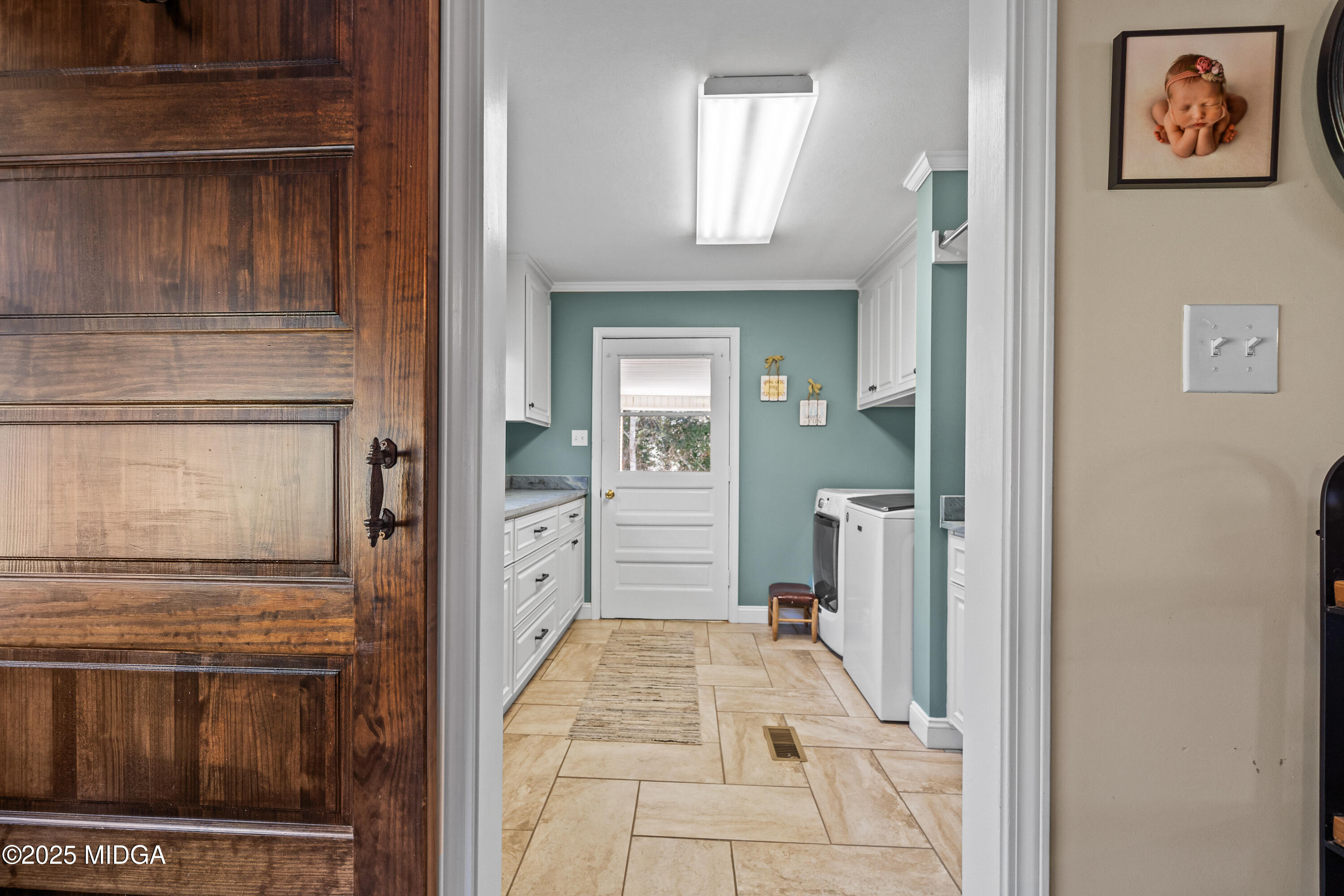 184 Camelot Road Gray, GA 31032 - Photo 16 of 38 a view of a hallway with wooden cabinet and door