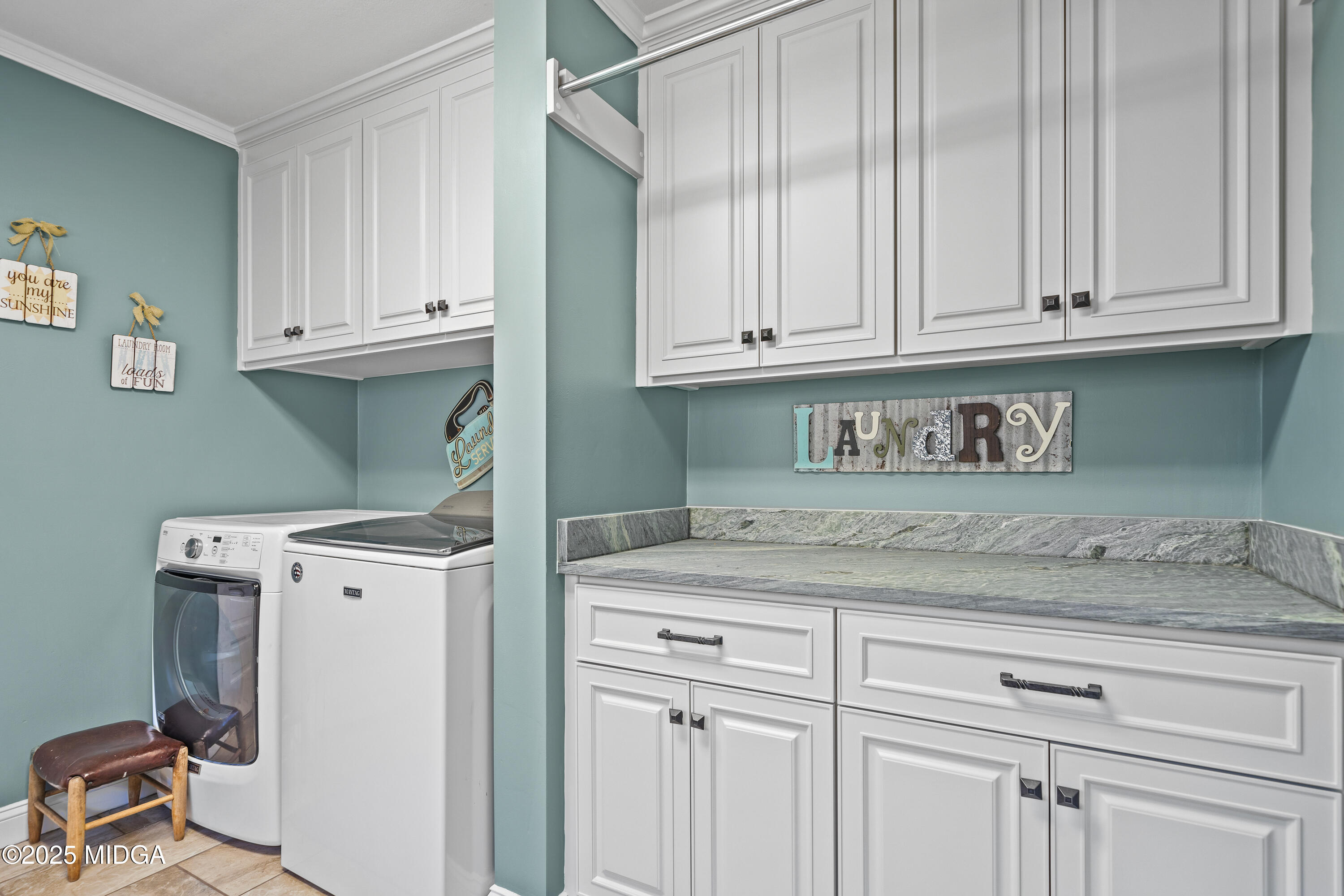 184 Camelot Road Gray, GA 31032 - Photo 18 of 38 a view of a storage and utility room with washer and dryer