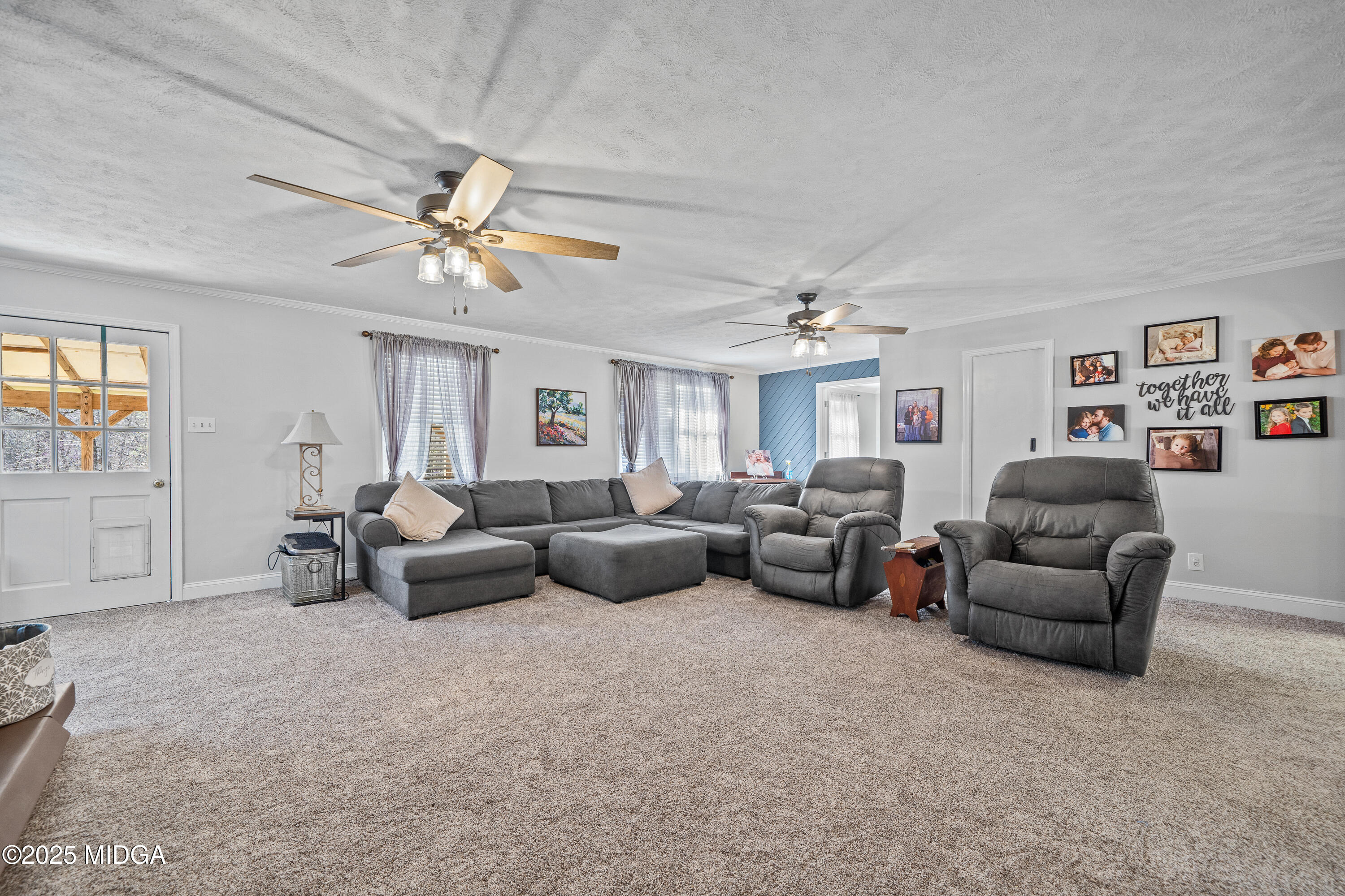 184 Camelot Road Gray, GA 31032 - Photo 20 of 38 a living room with furniture and a chandelier