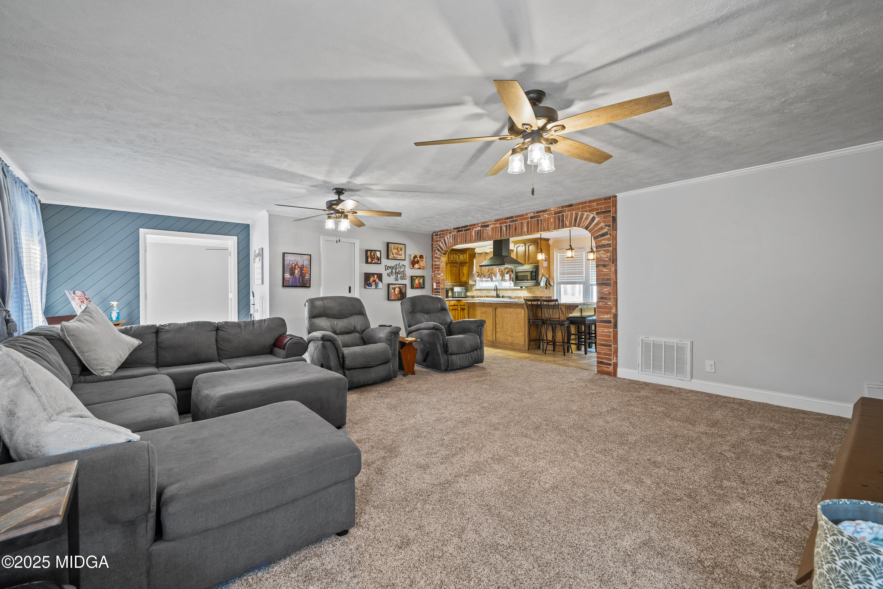 184 Camelot Road Gray, GA 31032 - Photo 21 of 38 a living room with furniture and a ceiling fan