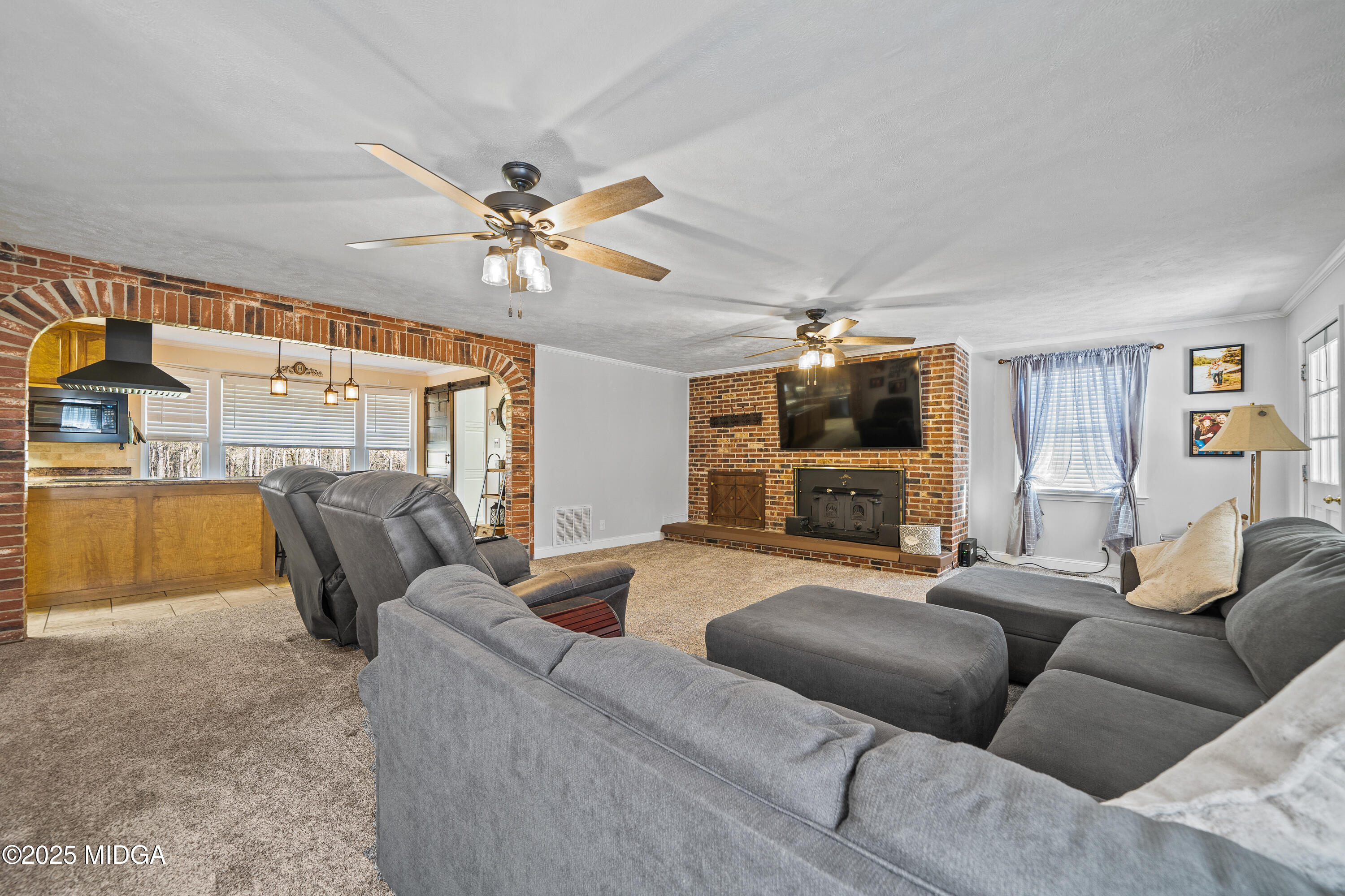 184 Camelot Road Gray, GA 31032 - Photo 22 of 38 a living room with furniture and a flat screen tv