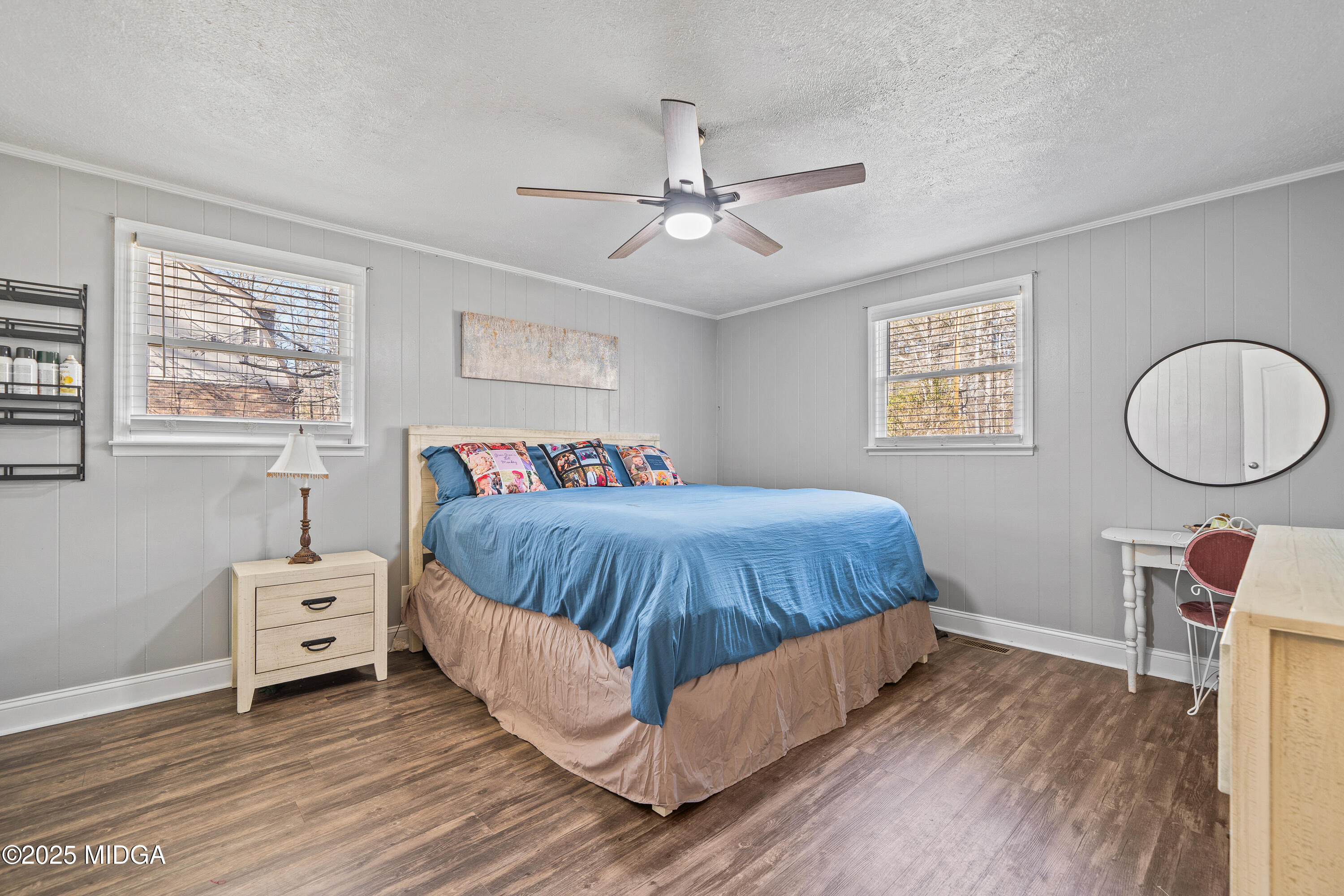 184 Camelot Road Gray, GA 31032 - Photo 23 of 38 a spacious bedroom with a bed and a window