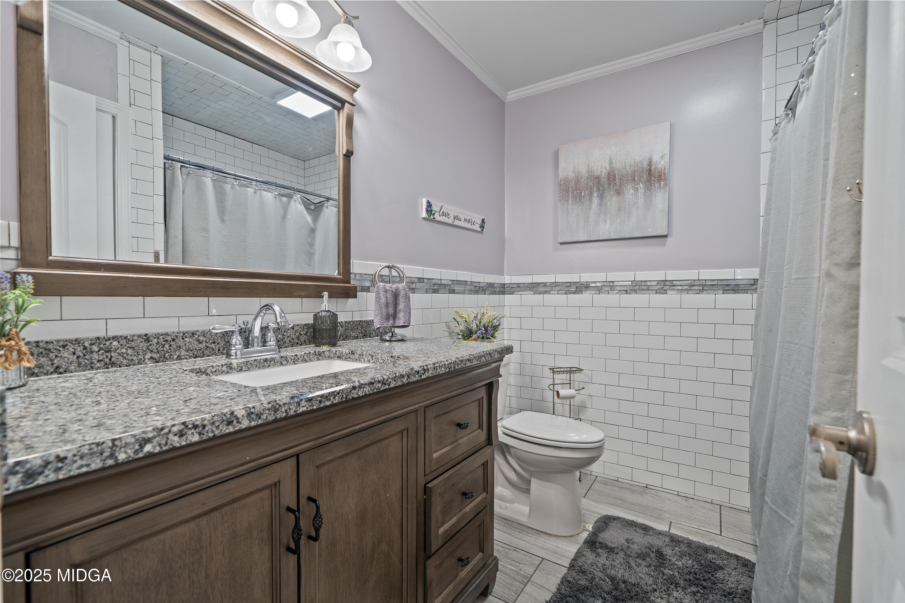 184 Camelot Road Gray, GA 31032 - Photo 29 of 38 a bathroom with a granite countertop toilet sink and mirror