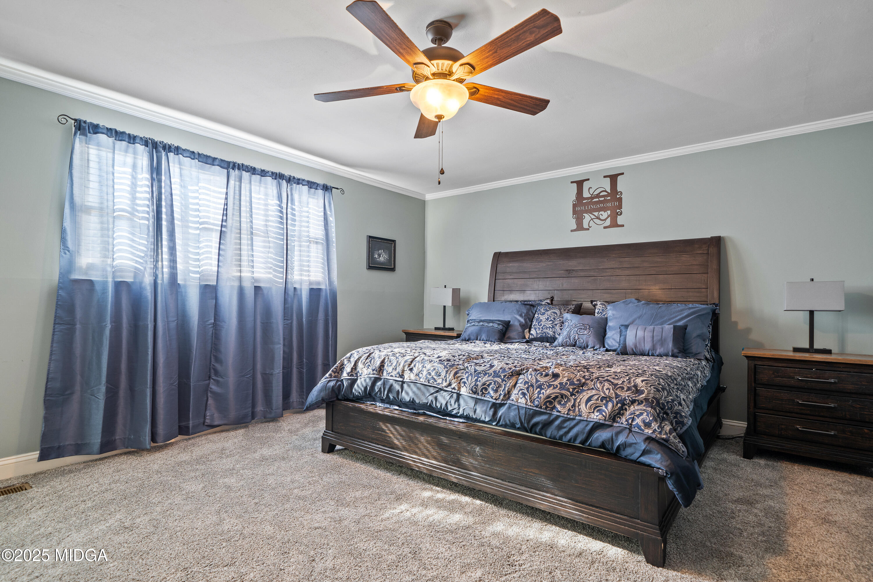 184 Camelot Road Gray, GA 31032 - Photo 30 of 38 a bedroom with a bed and a chandelier