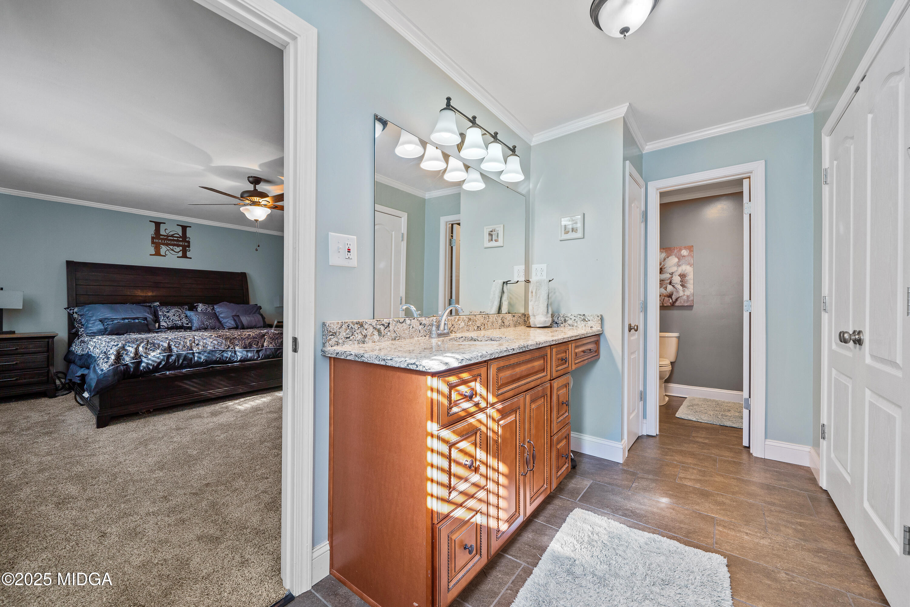 184 Camelot Road Gray, GA 31032 - Photo 32 of 38 a spacious bathroom with a granite countertop sink and a mirror