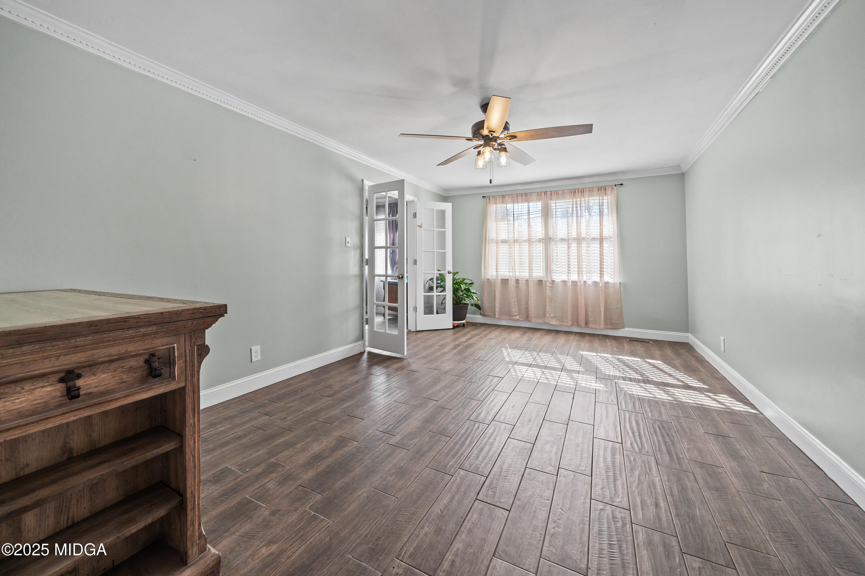 184 Camelot Road Gray, GA 31032 - Photo 6 of 38 wooden floor in an empty room with a window