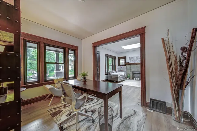 a view of a dining room with furniture window and wooden floor