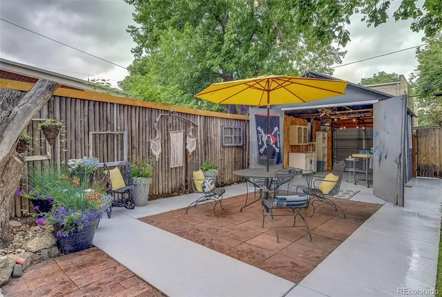 a swimming pool with outdoor seating and yard