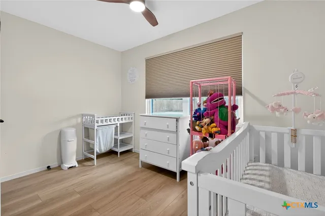 a view of a livingroom with furniture and hardwood floor